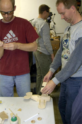 Everyone you see in this picture is working on the simple wooden plane...