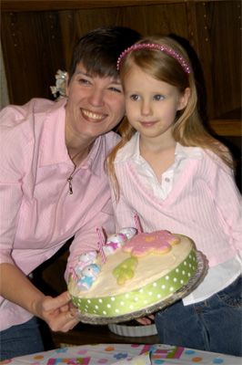 Mother and Daughter pose with the cake